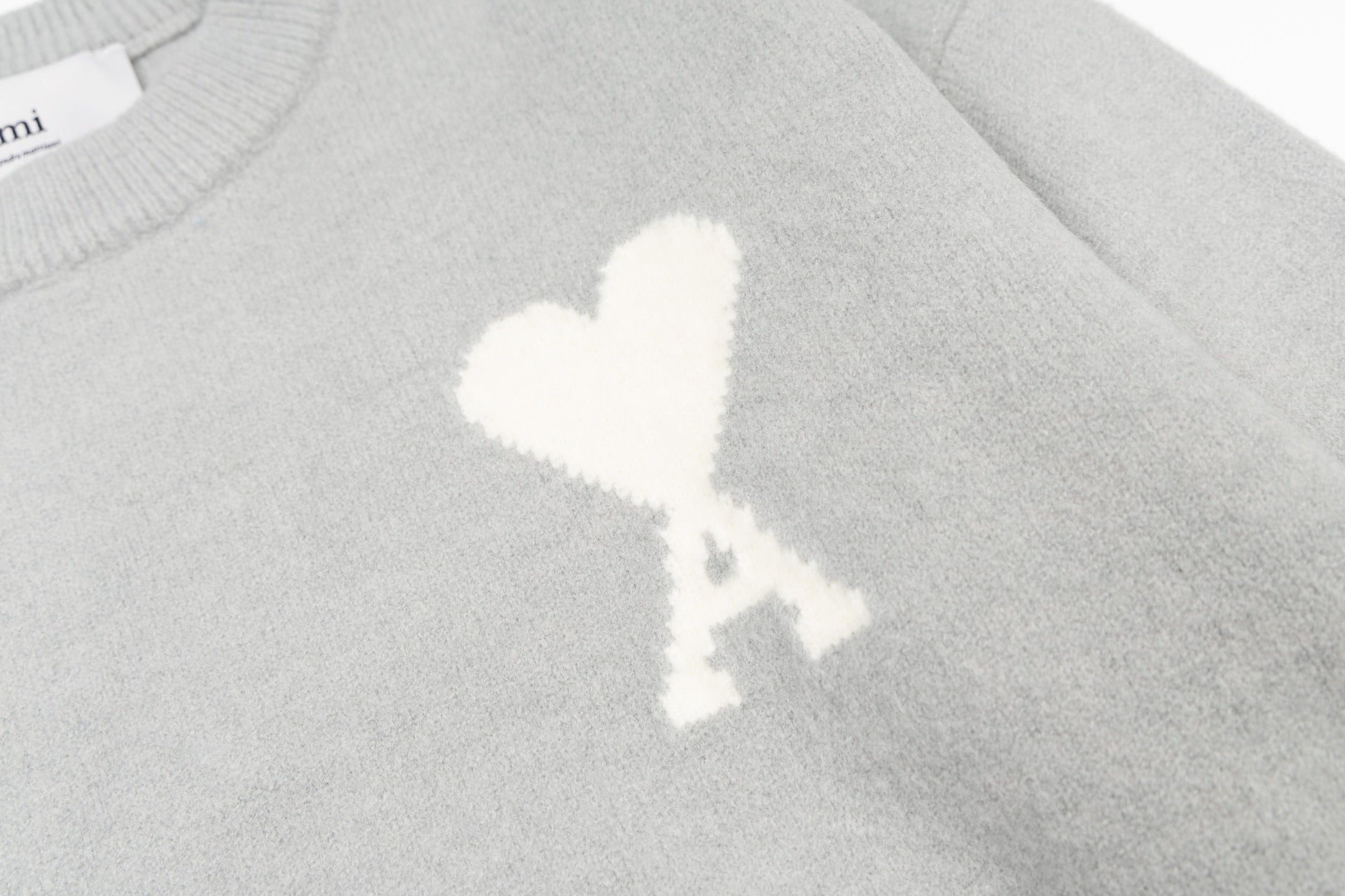 Amiri knit sweater with white heart A emblem on the chest