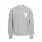 Amiri knit sweater in light gray with crew neck and white heart A logo