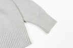 Amiri knit sweater close-up of ribbed hem and cuffs, light gray knit