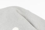 Amiri knit sweater sleeve cuff with soft light-gray knit texture