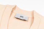 Amiri light peach knit cardigan neckline with interior brand label