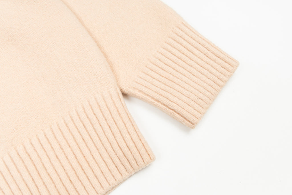 Amiri light peach ribbed knit cuff on cardigan sleeve