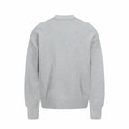 Amiri knit sweater in light gray with crew neck, ribbed cuffs, and hem