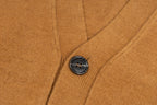 Tan knit cardigan with dark button and ribbed front placket