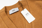 Tan knit cardigan with neck labels and ribbed collar