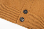 Tan cardigan button placket with two dark buttons