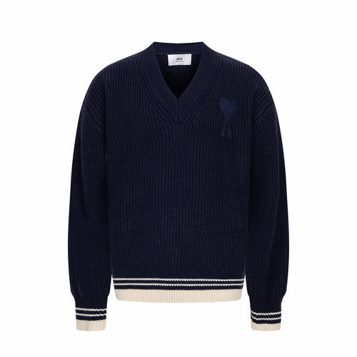 Navy knit sweater with V-neck and ribbed trim at cuffs and hem