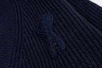 Navy ribbed knit sweater with raised embroidered graphic detail
