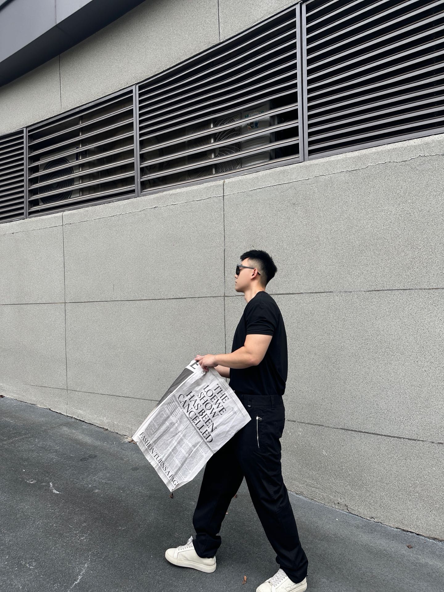 Black tapered pants with side pocket and Fendi-logo patch on the hip