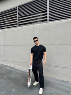 Black Fendi-logo patch pants with tapered fit, belt loops, and relaxed thigh