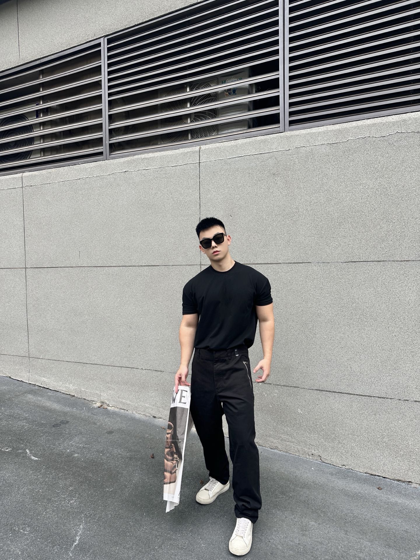 Black Fendi-logo patch pants with tapered fit, belt loops, and relaxed thigh