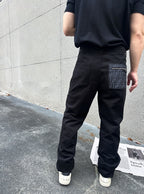 Black Fendi-logo patch cargo pants with tapered legs and cuffed hems