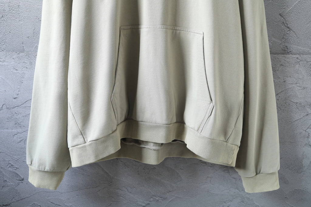 Off-white hoodie front with kangaroo pocket and ribbed hem