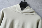 Off-white pullover hoodie with draped hood and inner neckline