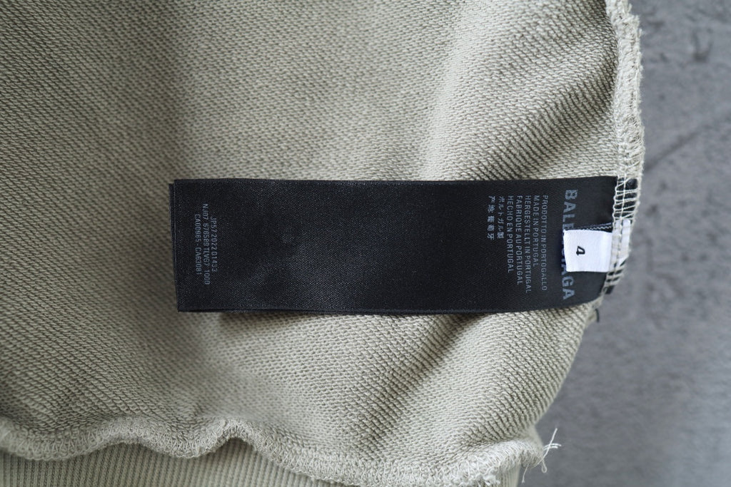 Off-white hoodie fabric label area with printed tag