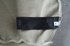 Off-white hoodie fabric label area with printed tag