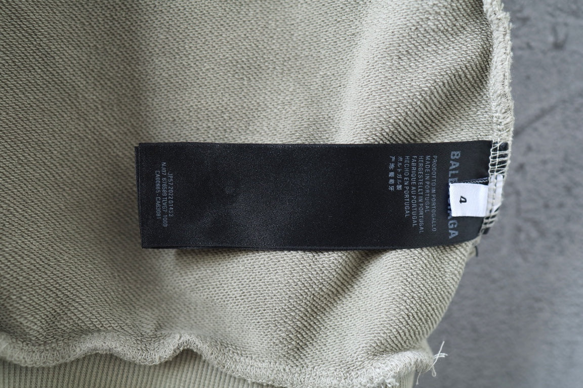Off-white hoodie fabric label area with printed tag