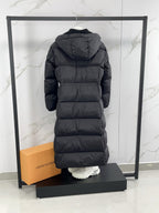 Long puffer coat with hood, back view, dark color, quilted horizontal baffles