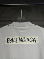 White Balenciaga T-shirt back view close-up showing large logo across upper back