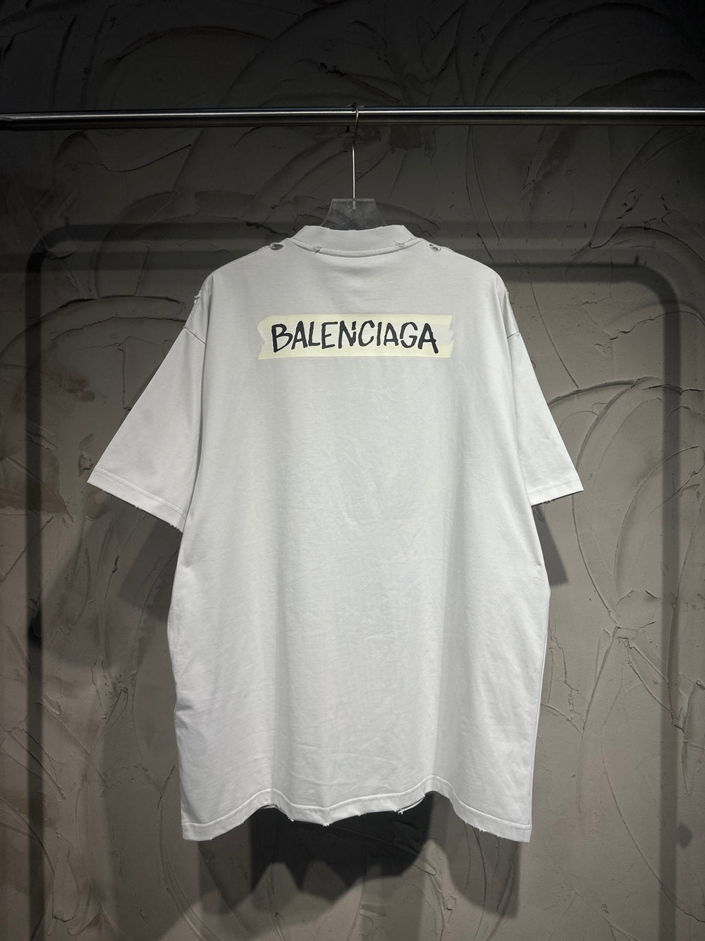 White Balenciaga T-shirt front view with chest logo and straight hem