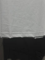 White Balenciaga T-shirt hem and bottom seam close-up