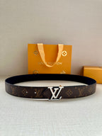 Dark brown monogram leather belt with metal LV buckle.