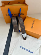 Louis Vuitton reversible-style belt with dark brown monogram strap and silver buckle