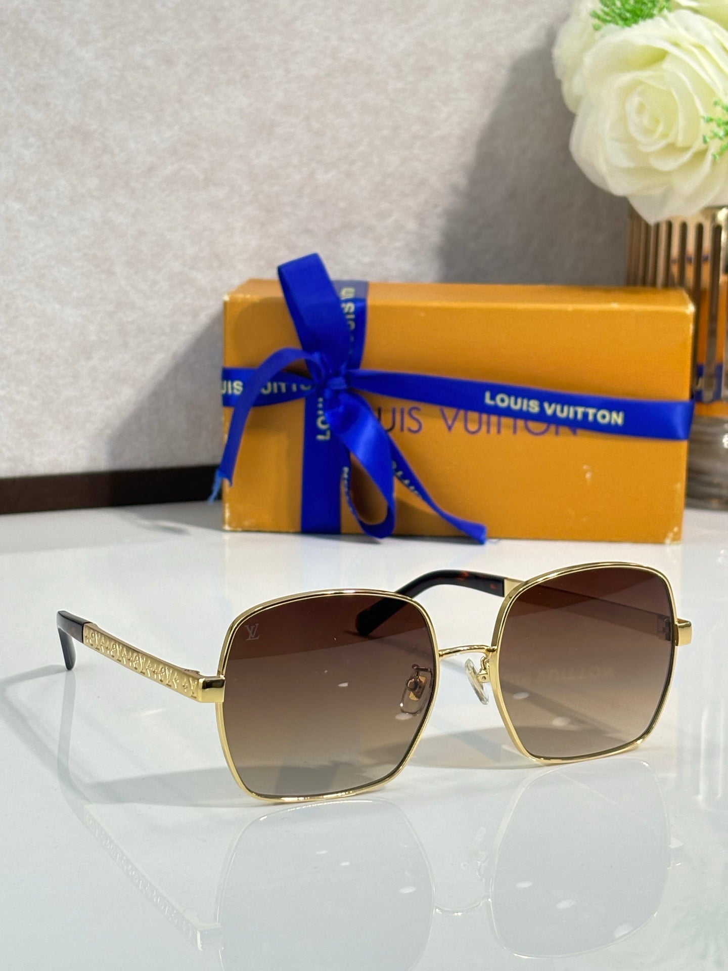 Gold-tone square sunglasses with gradient brown lenses and textured temple arms