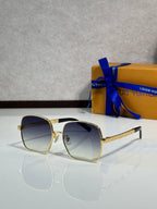 Gold-tone square sunglasses with dark lenses and textured gold temple arms