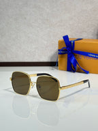 Gold-tone square sunglasses with dark lenses and textured gold temple arms