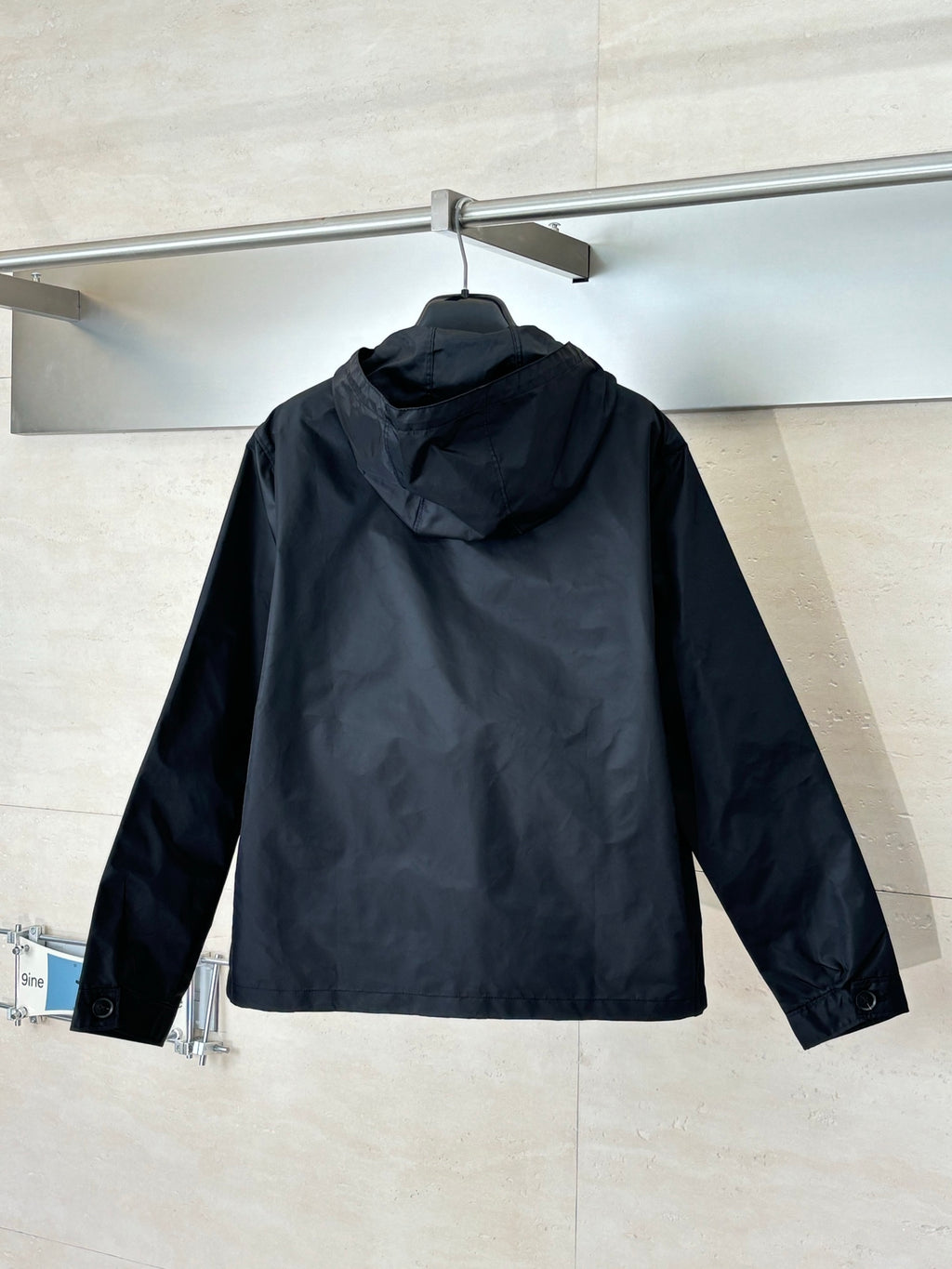 Prada black hooded long jacket, back view with full zip and logo