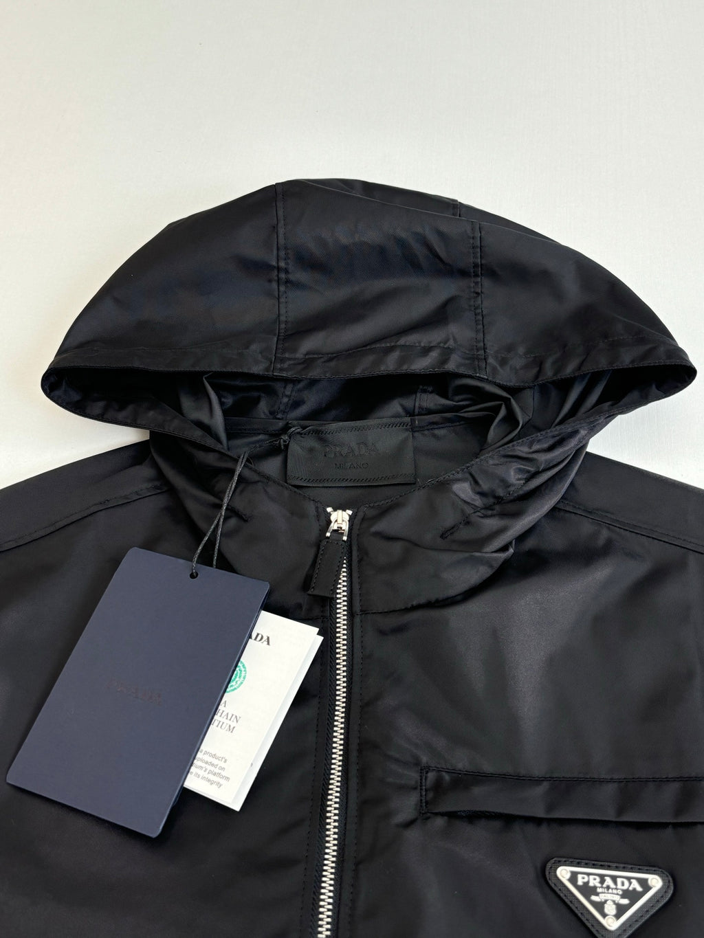 Prada black hooded jacket with zip-front and triangular logo patch