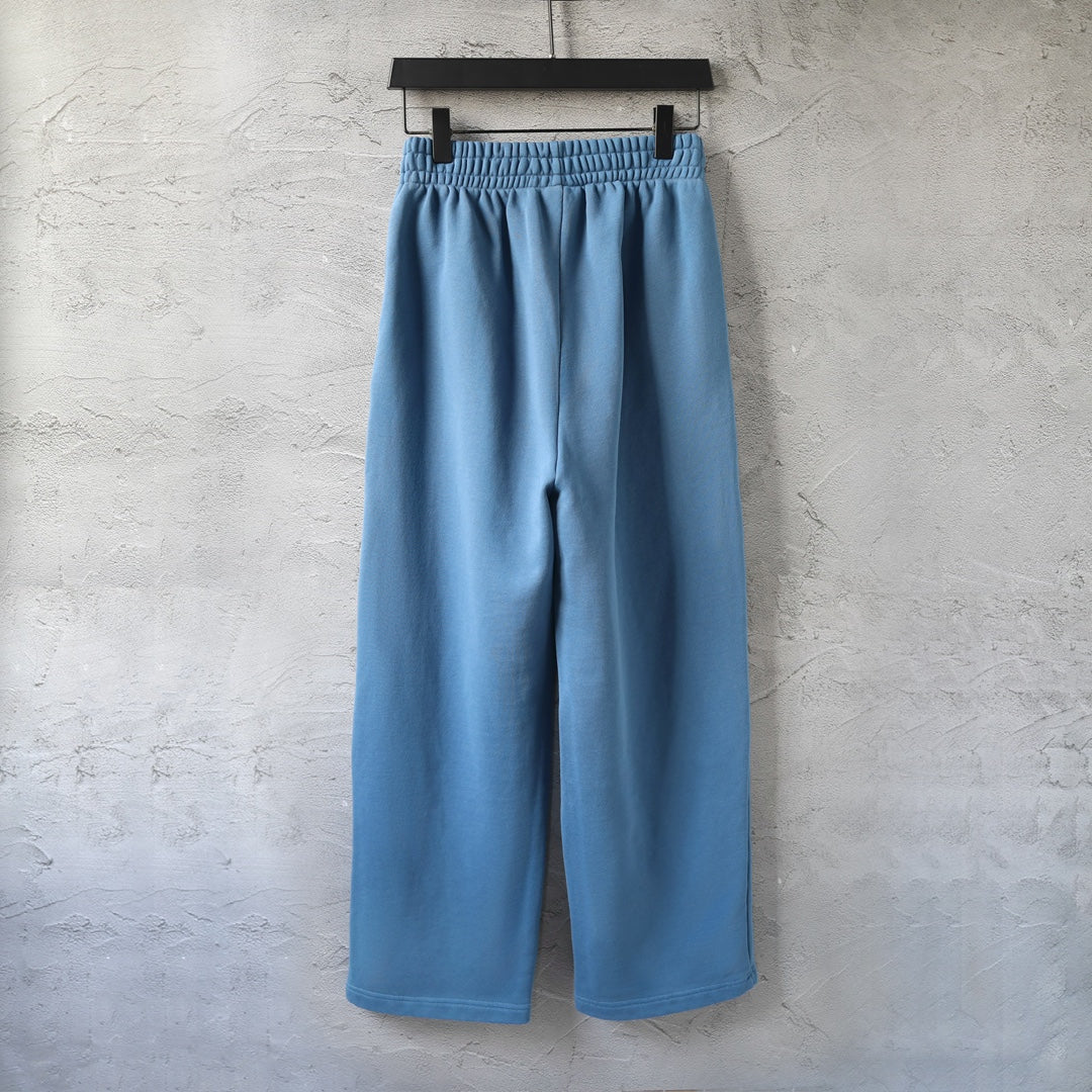 Balenciaga wide-leg pants in light blue, front view with elastic waistband