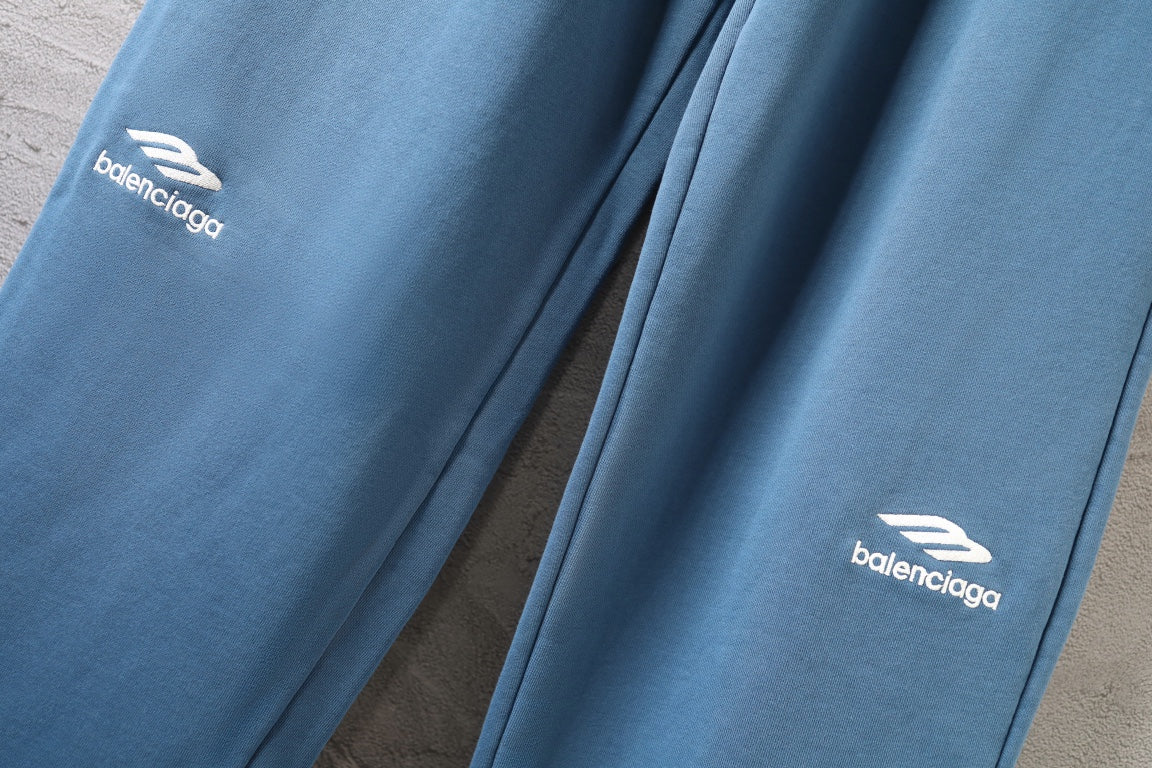 Blue pants with Balenciaga logos on left and right legs