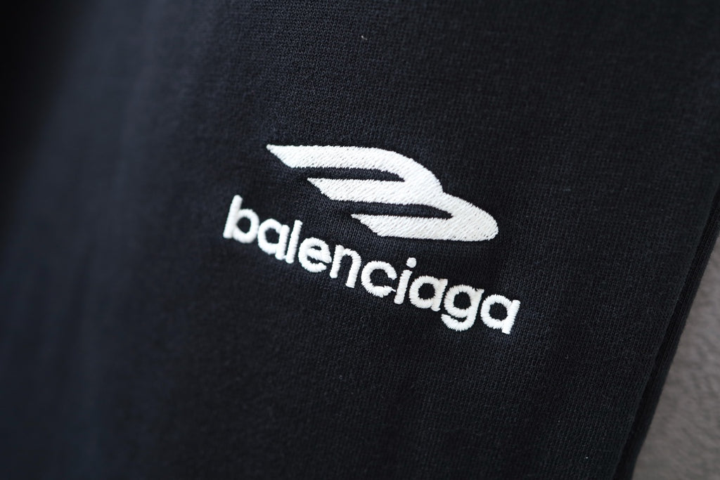 Balenciaga embroidered logo on black pant leg