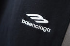 Balenciaga embroidered logo on black pant leg