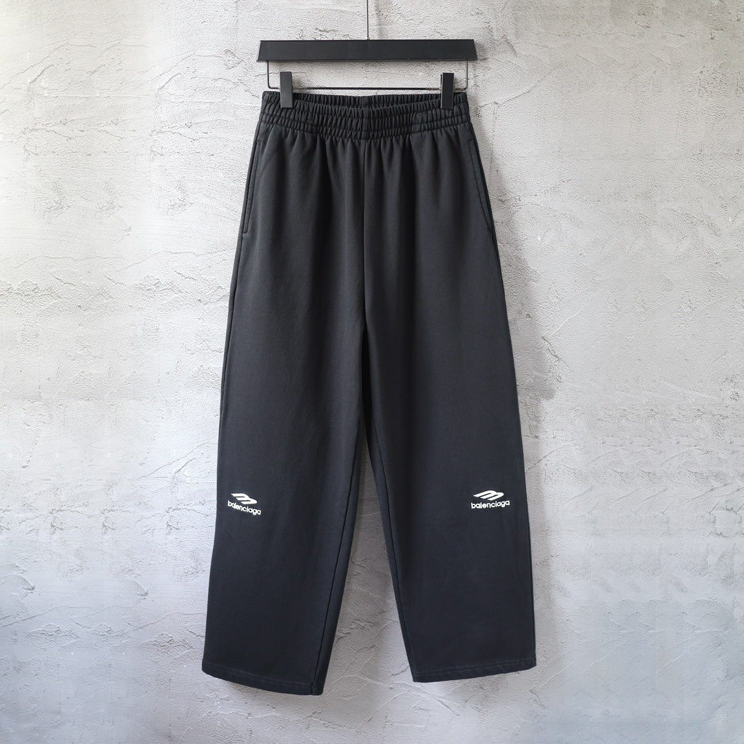 Balenciaga black wide-leg pants with elastic waistband and logo patches