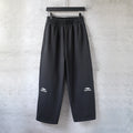 Balenciaga black wide-leg pants with elastic waistband and side logo prints