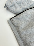 Light gray Louis Vuitton monogram track pants with drawstring waist and cuffs