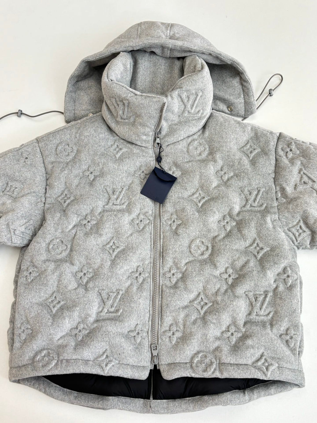 Light gray Louis Vuitton monogram hooded jacket, full-zip front and high collar