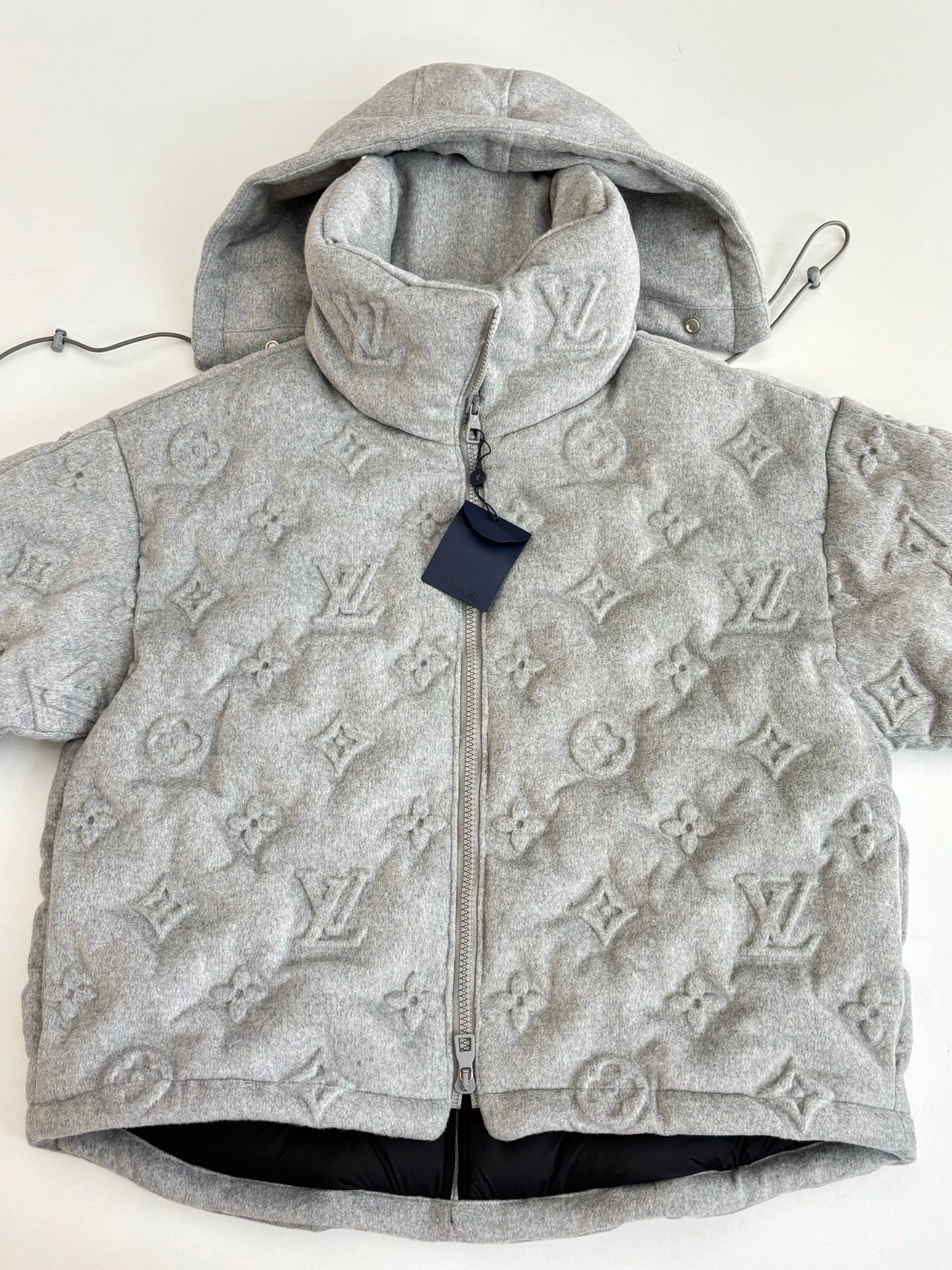 Light gray Louis Vuitton monogram hooded jacket, full-zip front and high collar