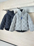 Light gray and dark Louis Vuitton monogram hooded jackets on hangers