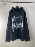 Dark long-sleeve hoodie with hood and kangaroo pocket, featuring a large front graphic.