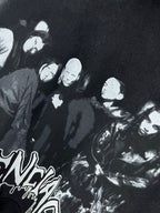 Dark hoodie close-up with large black-and-white crowd graphic print.