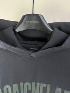 Dark navy hoodie with BALENCIAGA logo on inner neck label