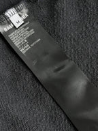 Dark navy hoodie care label and size tag inside collar