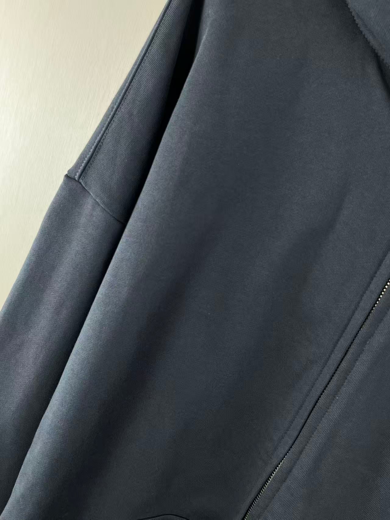 Balenciaga dark navy zip hoodie detail view of side panel and zipper