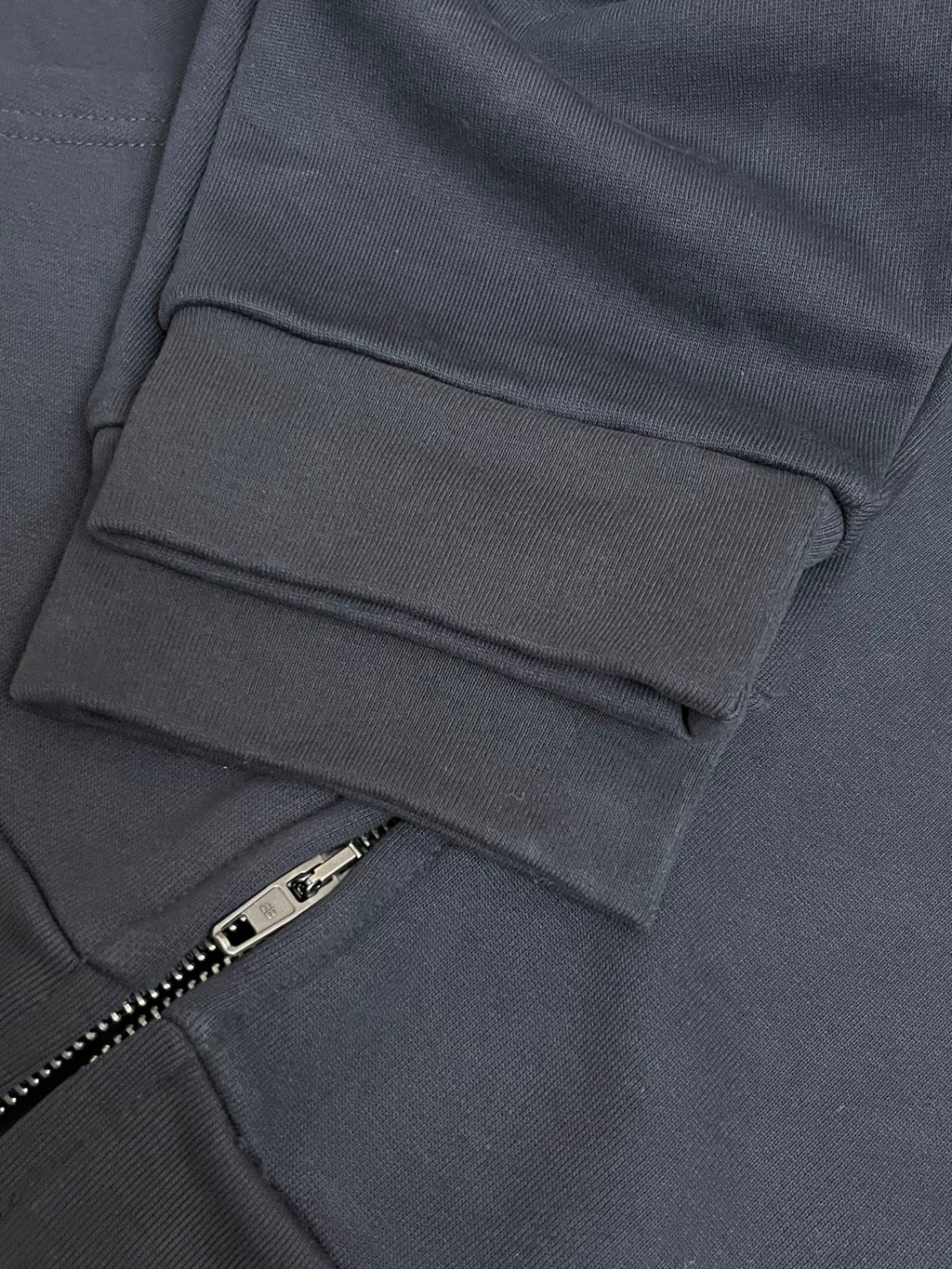 Balenciaga dark navy zip hoodie front pocket and zipper pull detail