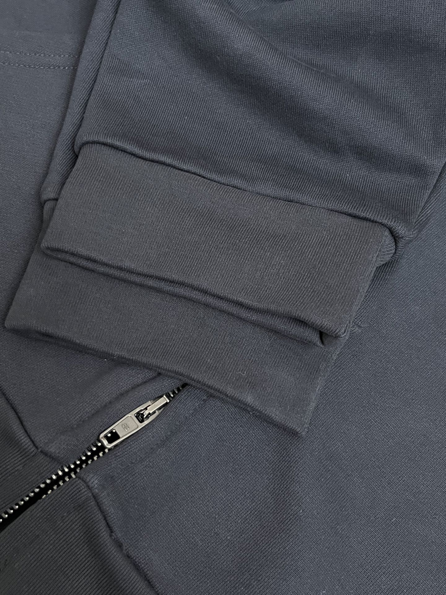 Balenciaga dark navy zip hoodie front pocket and zipper pull detail