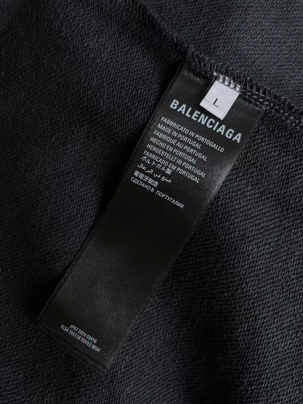 Balenciaga inside label on dark navy zip hoodie collar